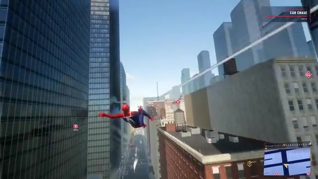 Character releases the web line and glides between buildings