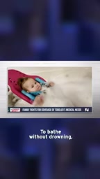 To bathe without drowning, Emmy needs to be strapped into this chair.